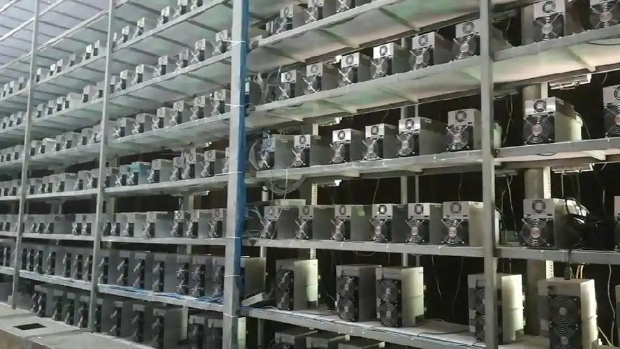 Modern mining farm with racks full of mining rigs