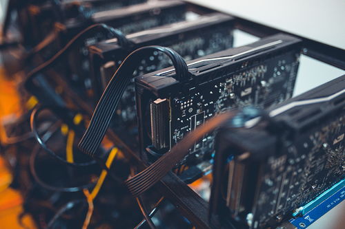 A detailed view of a high-efficiency mining rig setup, showcasing advanced power supplies that optimize cryptocurrency mining